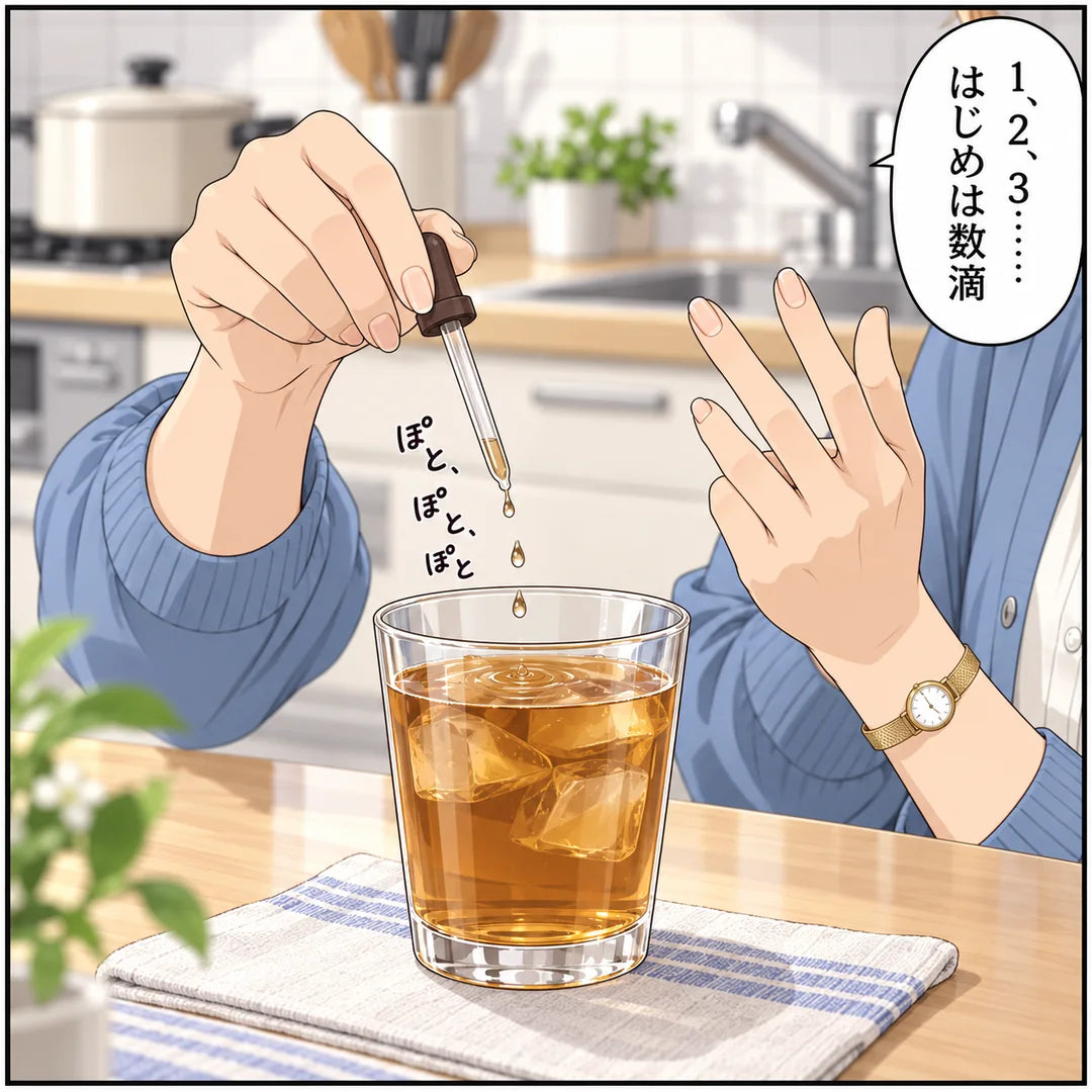 麦茶のコップにスポイトで1滴ずつ、指で数えながら垂らす